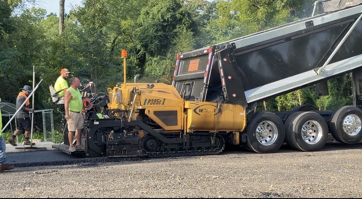 Crew laying down asphalt at a commercial parking lot in Bucks County, PA