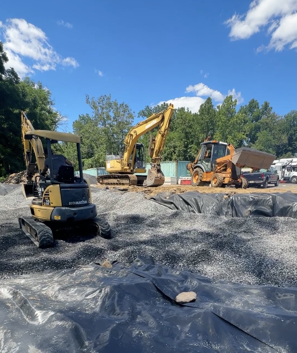 Commercial property maintenance crew servicing a shopping center parking lot in Bucks County, PA