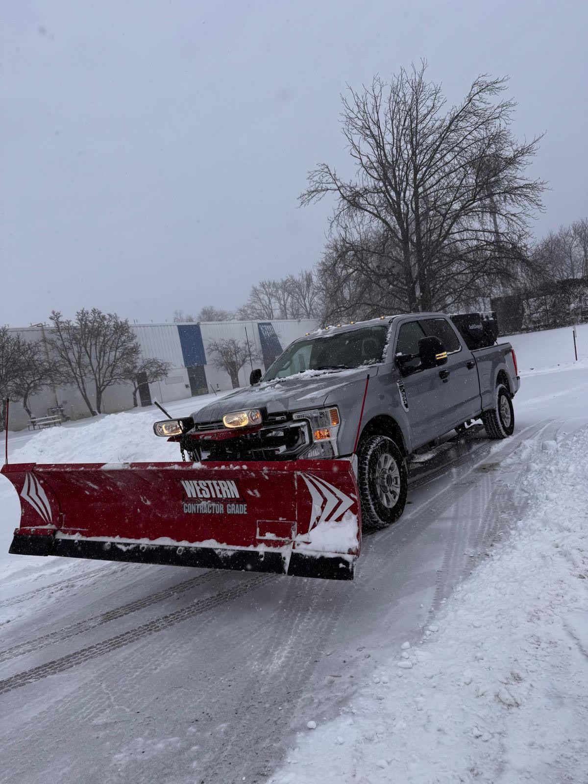 Devlin Services plow truck clearing a commercial parking lot in Bensalem, PA