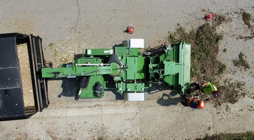 Crew running a stump grinder during commercial tree removal in Philadelphia, PA