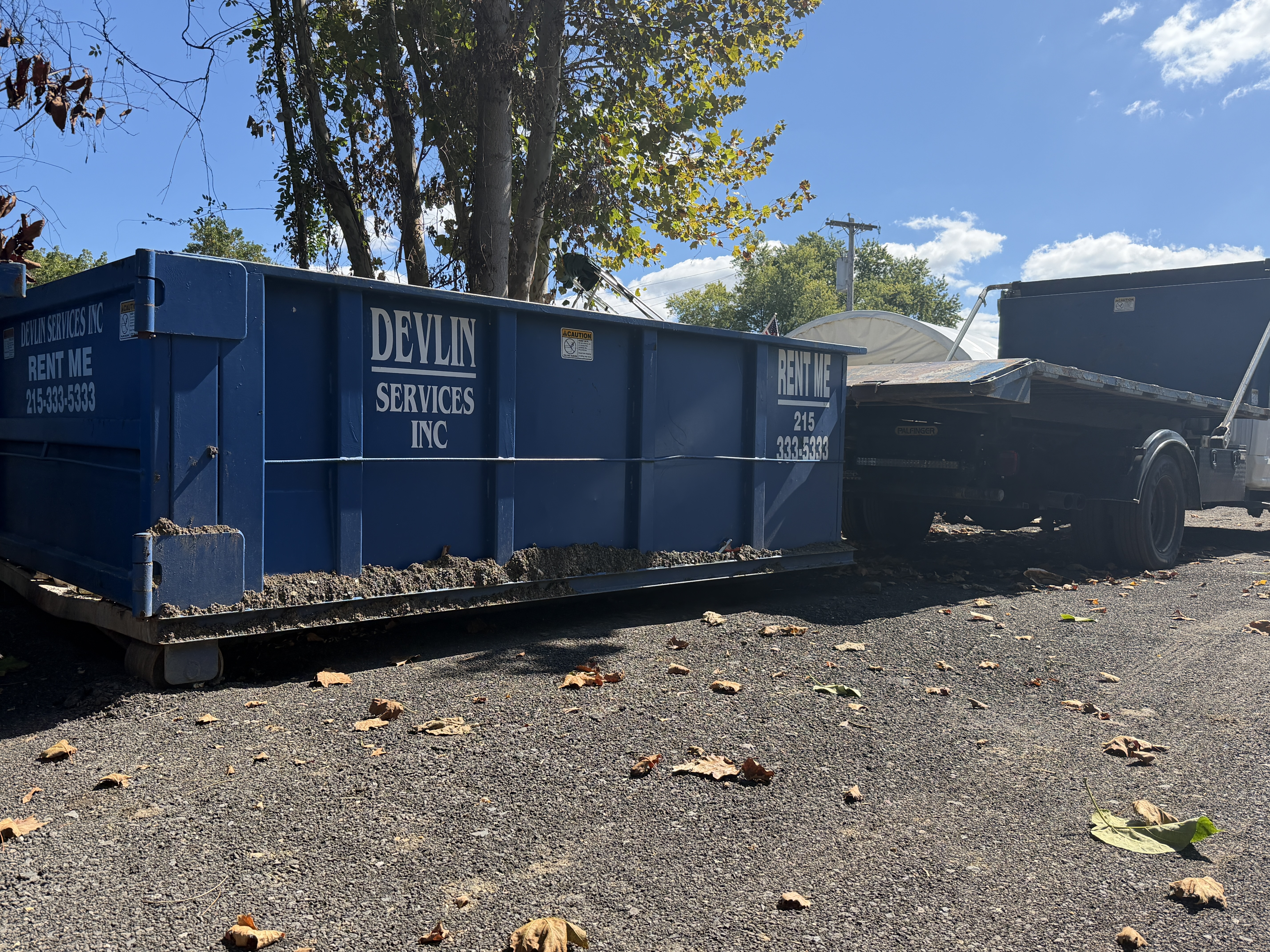 Crew loading debris into a truck during a commercial property cleanout in Bucks County, PA